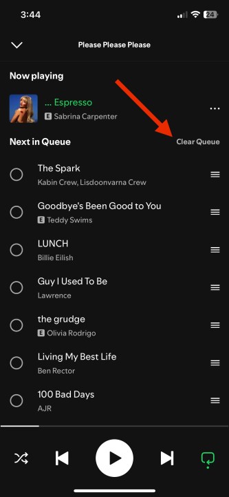 A red arrow pointing to the Clear Queue option on Spotify for iOS.